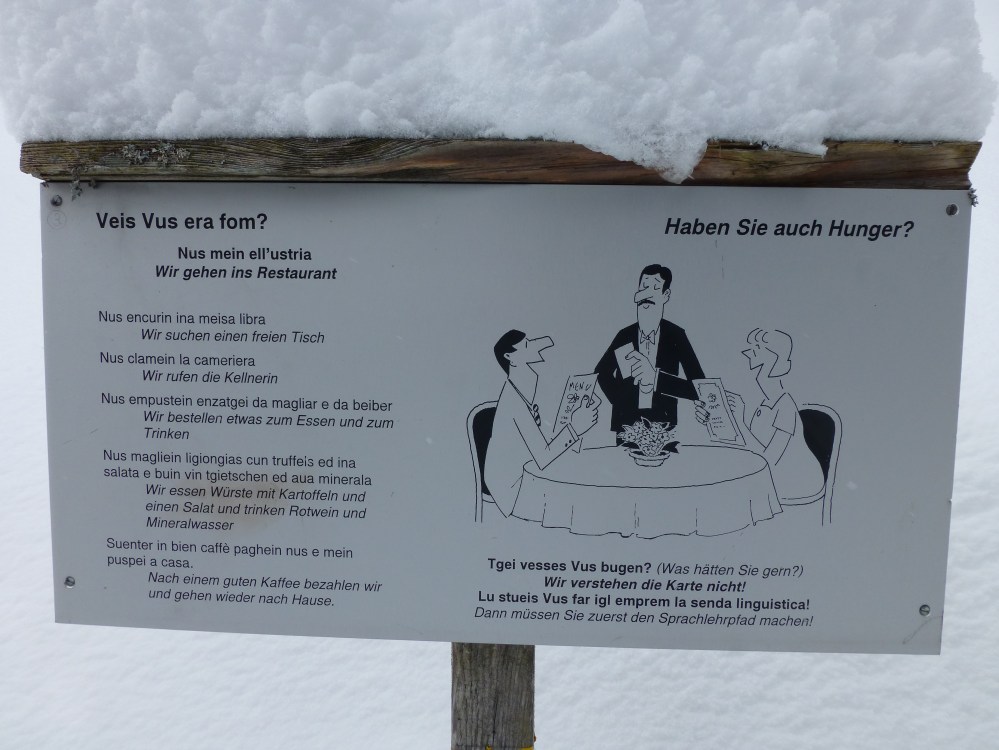 Signs along the Flims hiking trail teaching Romansh (one of Switzerland's 4 official languages)